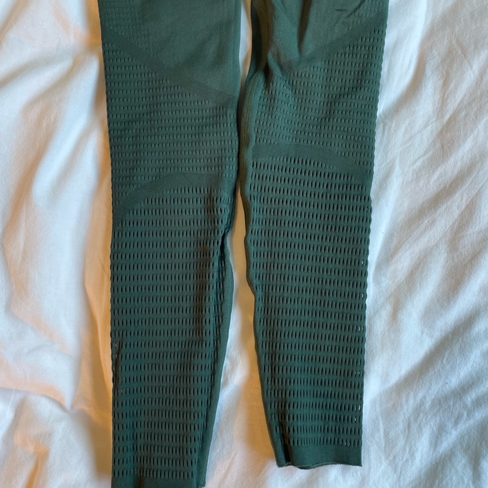 Fabletics green leggings with cool cutout design on the bottom